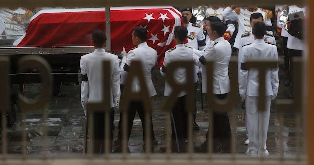 ARRIVAL AT UCC. Military pallbearers remove the coffin of the late Mr Lee Kuan Yew from its gun carriage before bringing it into the National University of Singapore University Cultural Centre for the state funeral of the country's first Prime Minister in Singapore, 29 March 2015. Wallace Woon/EPA 