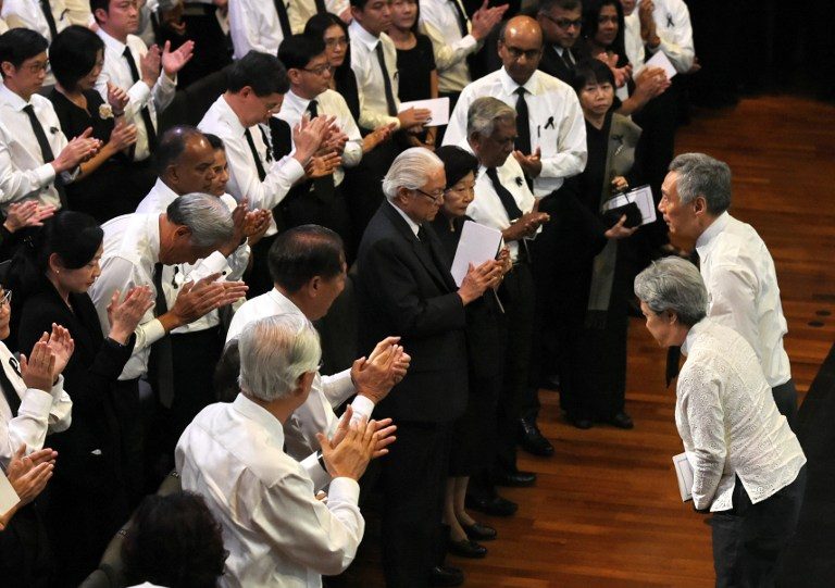 SINGAPORE'S LEADER. Singapore's Prime Minister Lee Hsien Loong with his wife Ho Ching bow to guests during the funeral service for Singapore's late former prime minister Lee Kuan Yew in Singapore on March 29, 2015. Roslan Rahman/AFP 