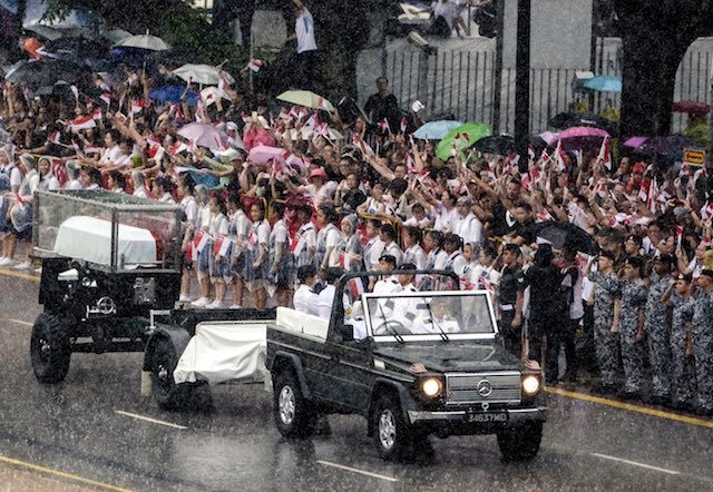 BRAVING THE RAIN. The State Funeral Procession of late former Prime Minister Lee Kuan Yew passes by the Padang in Singapore, 29 March 2015. Tom White/EPA 
