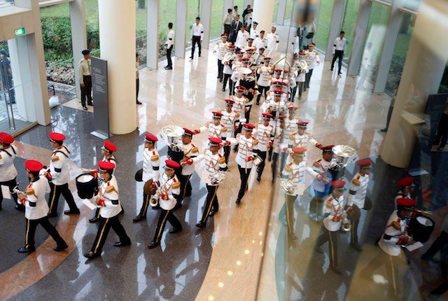 FAREWELL MARCH. Military bandsmen march out of the National University of Singapore University Cultural Centre after the state funeral of the late Mr Lee Kuan Yew in Singapore, 29 March 2015. Wallace Woon/EPA 