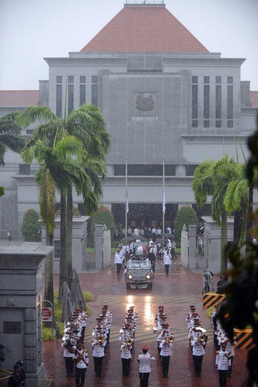 GOODBYE, PARLIAMENT. The body of Singapore's former prime minister Lee Kuan Yew is transferred atop a gun carriage as they leave Parliament House during a funeral procession in Singapore on March 29, 2015. Mohd Fyrol/AFP 