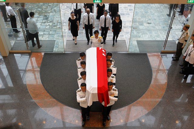 SOLEMN ARRIVAL. Military pallbearers carry the coffin of late Mr Lee Kuan Yew into the National University of Singapore University Cultural Centre for the state funeral of the country's first Prime Minister in Singapore, 29 March 2015. Wallace Woon/EPA 