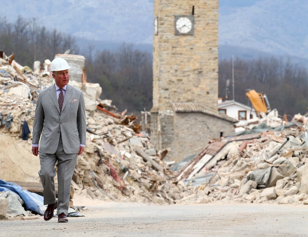 Prince Charles embraces Italy quake survivors