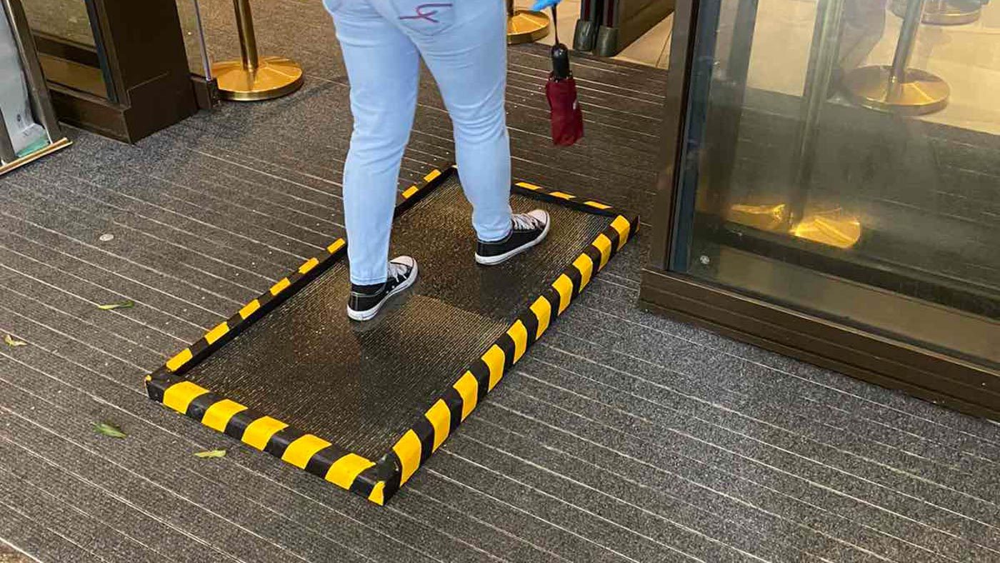 DISINFECTION. Mats soaked in disinfectant are positioned at the mall entrance. Photo courtesy of Megaworld Lifestyle Malls 
