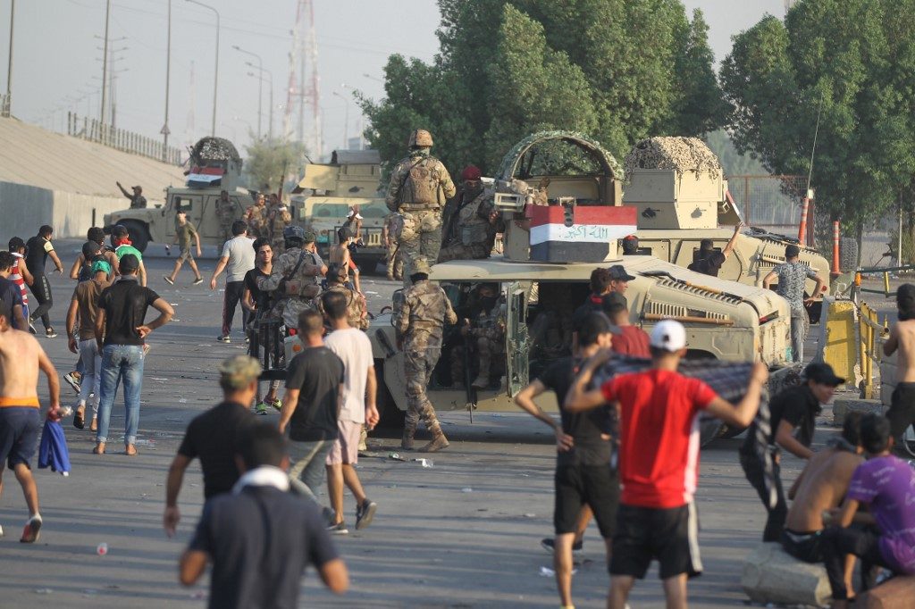 Iraq forces fire on dozens of protesters in Baghdad