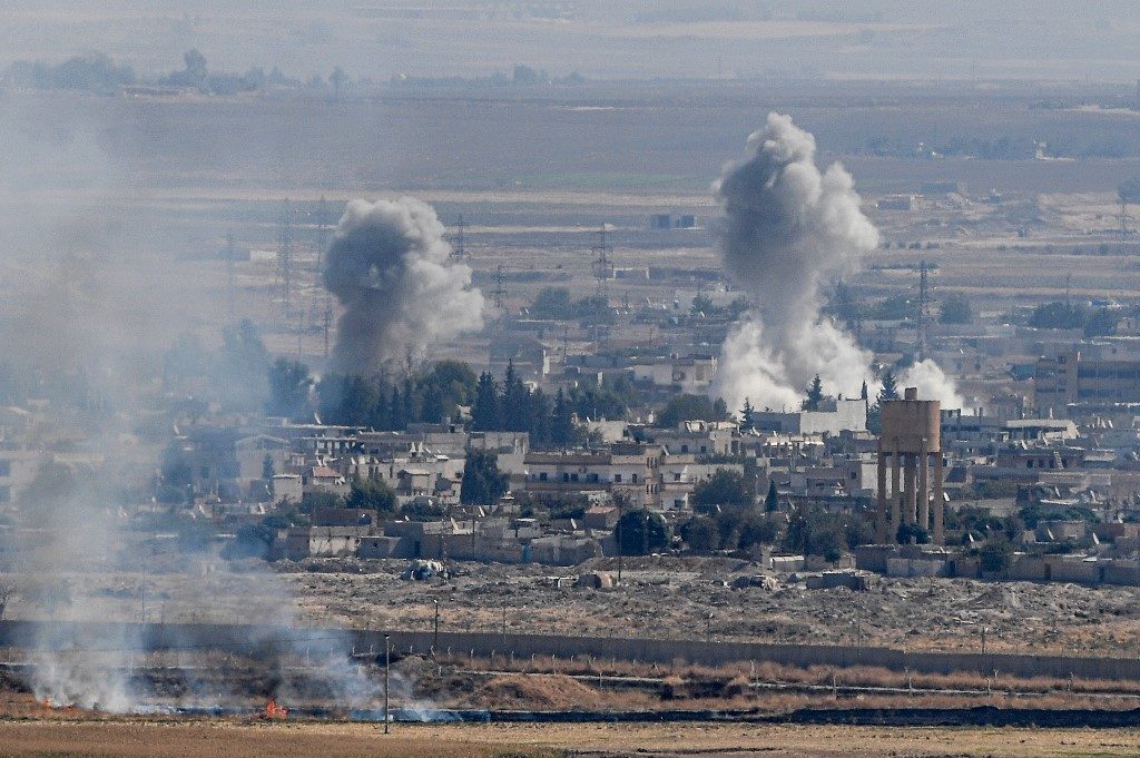 Syria Kurds defend key town as Turkey ignores U.S.