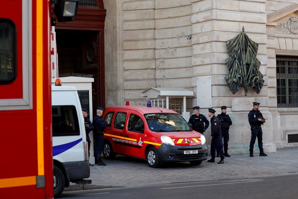 Hunt for motive of staffer who killed 4 at Paris police HQ