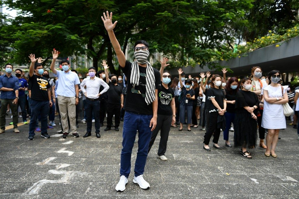 New protests as Hong Kong government mulls face mask ban