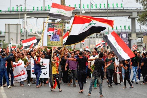 More than a dozen dead in renewed Iraq protests as thousands rally