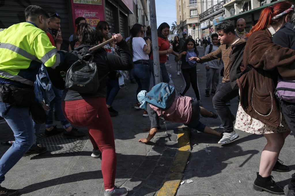 Child latest victim of Chile violence as strike begins