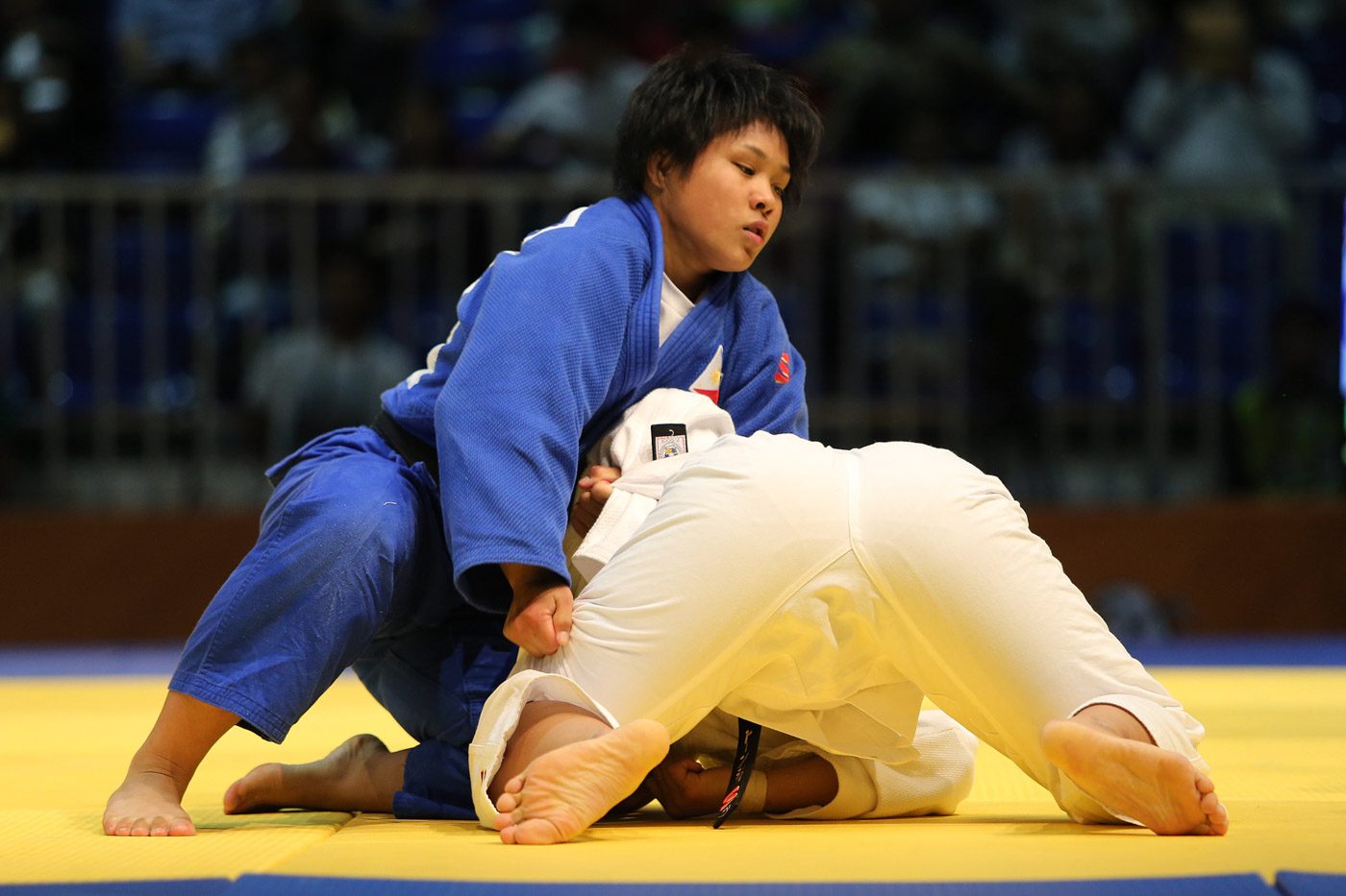 Mariya Takahashi of the Philippines competes against Surattana Thongsri of Thailand in the finals of the women's -70kg class of the 29th Southeast Asian Games judo competition at the Kuala Lumpur Convention Center Hall 5. Takahashi prevailed via ippon in 48 seconds to win the gold medal. Photo from PSC-POC Media 