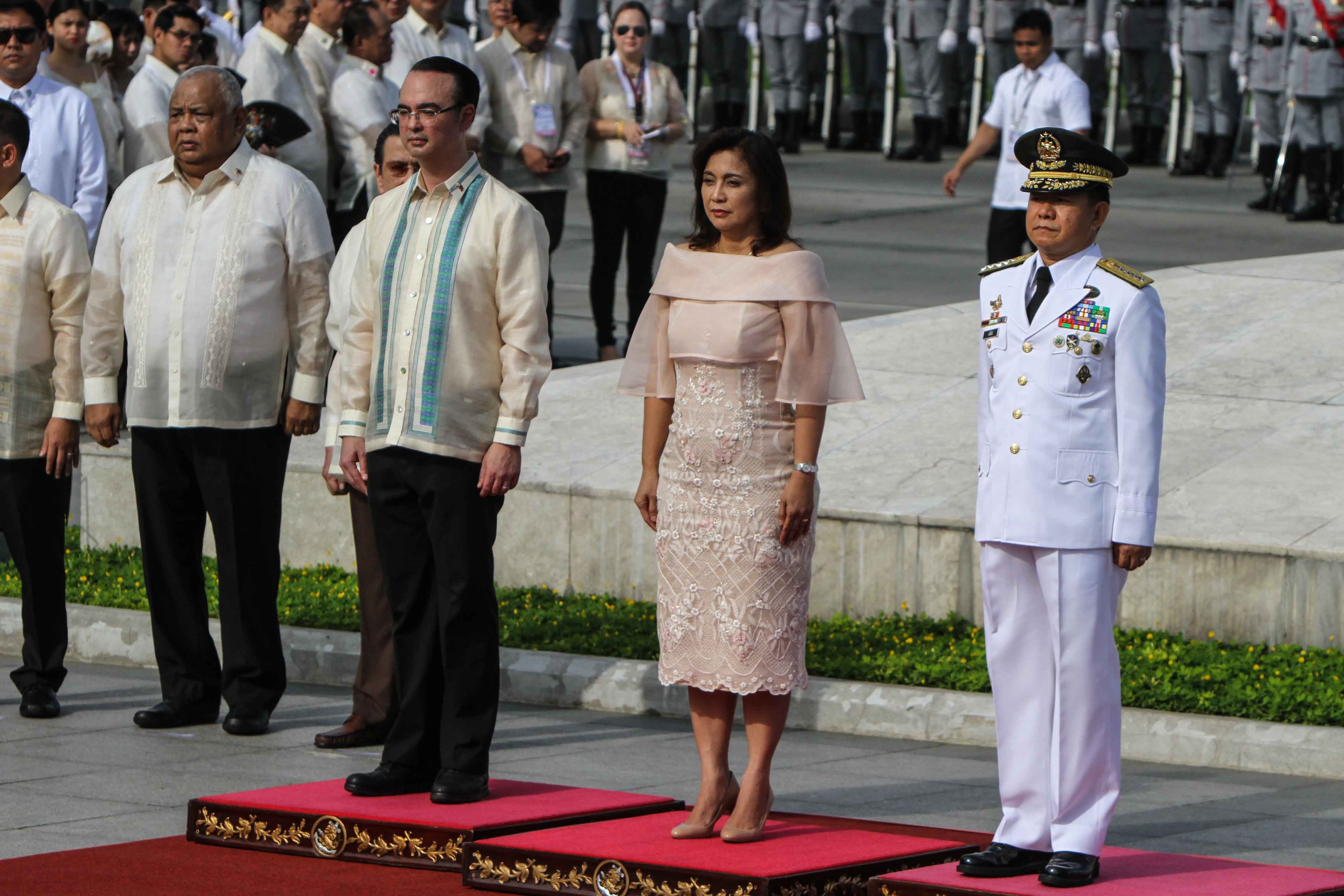 WITHOUT THE PRESIDENT. Vice President Leni Robredo (center) with Foreign Secretary Alan Peter Cayetano (left) and Armed Forces of the Philippines chief General Eduardo Año (right) at the Rizal Monument after the flag-raising ceremony. Photo by Lito Boras/Rappler 