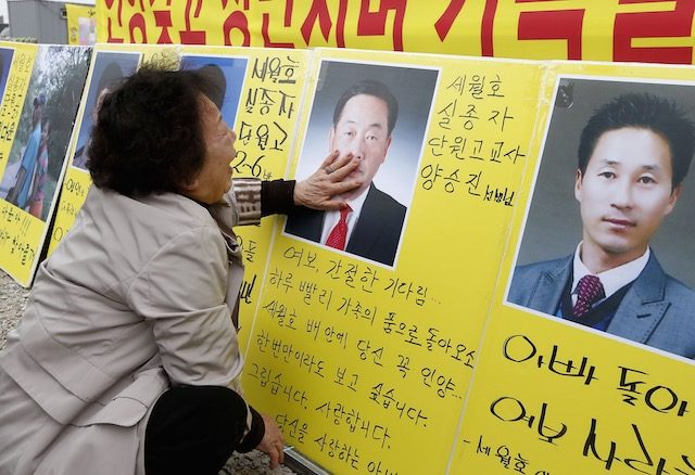 South Korea vows to raise sunken ferry but angry relatives unmoved