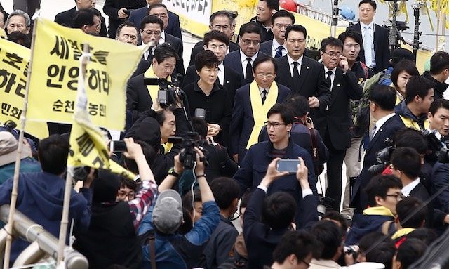 South Korean president Park Geun-Hye (C, back) arrives at Jindo port, on Jindo Island, in the southwestern province of South Jeolla, South Korea, 16 April 2015. Jeon Heon-Kyun/EPA 