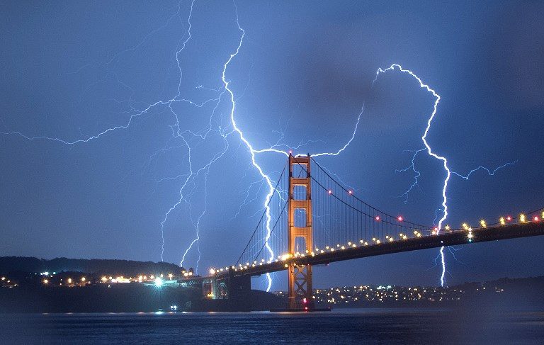 THE SKY OVER SANFO. Lightning strikes over the Golden Gate Bridge in San Francisco, California, on September 11, 2017. Photo by Josh Edelson/AFP   