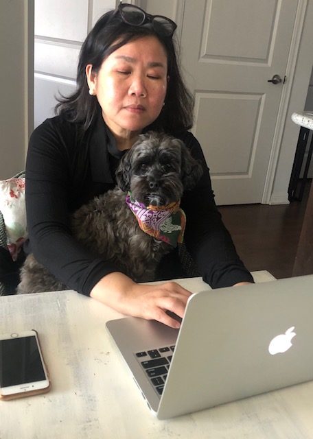 HOME OFFICE. The author with the family dog, Olive, working from home. Photo by Beatrice Paez    