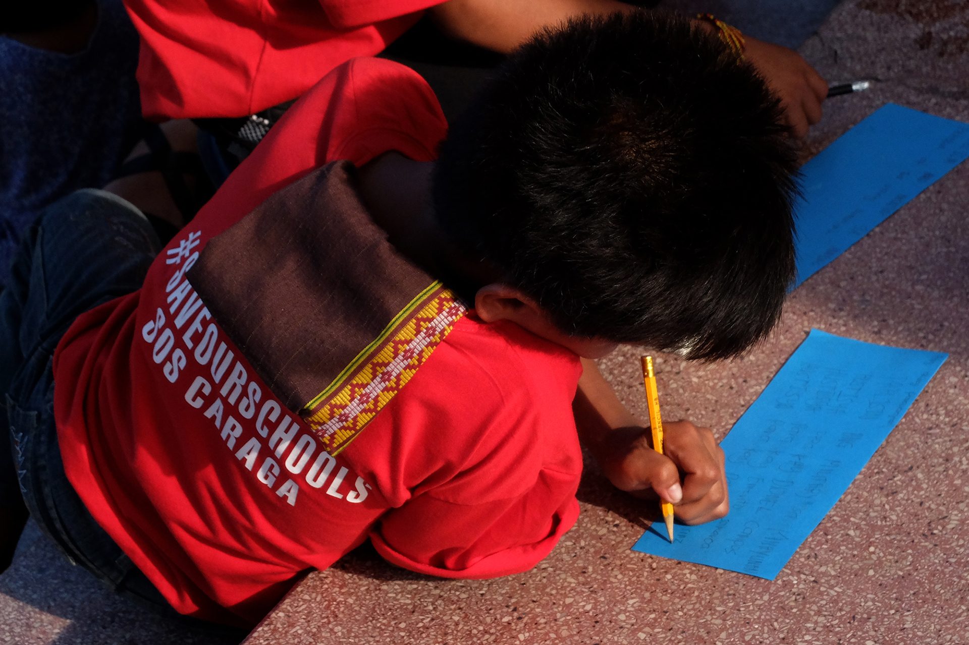 A CHILD'S WISH. A boy writes a letter to President Rodrigo Duterte. Photo by Angie de Silva/Rappler   