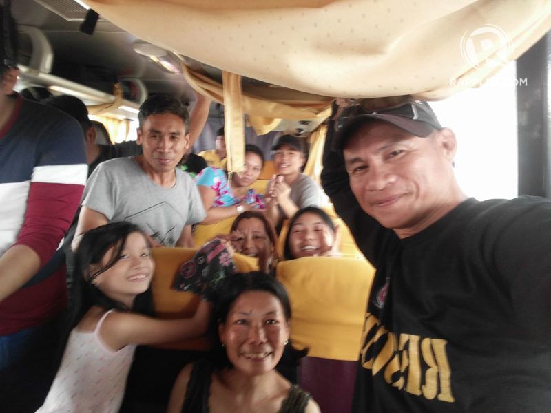 AMID THE STORM. Winston with Julito Gaviola (Gray shirt) pose with other stranded passengers. Photo by Winston Regarde 
