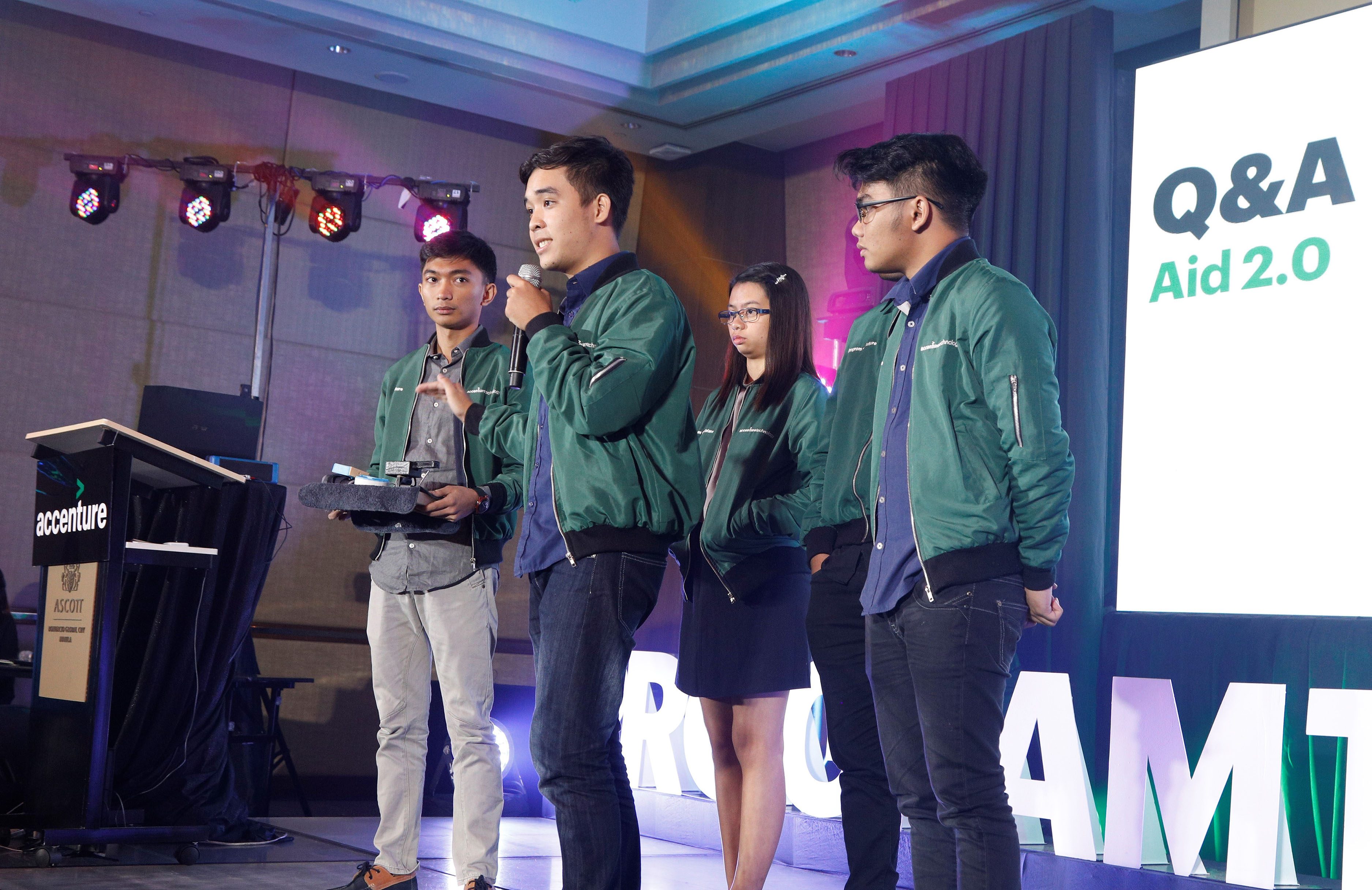  TEAM AID 2.0. The team from University of San Carlos – Cebu answers questions about their device, Tactus. Photo courtesy of Accenture.