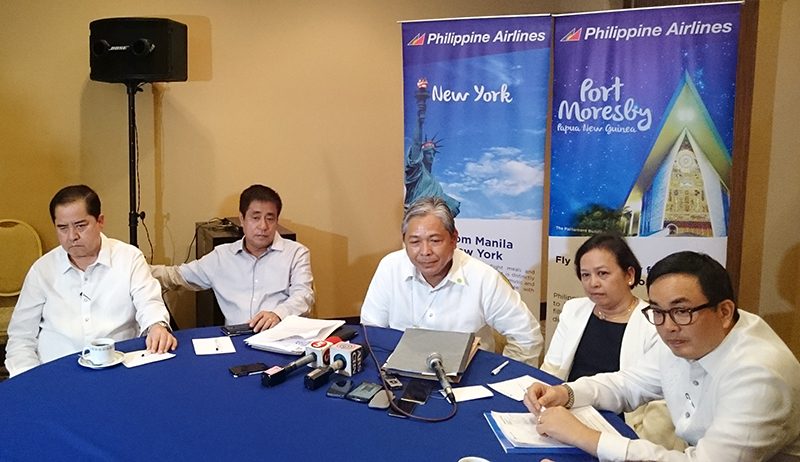 CHARTING A COURSE. PAL President Jaime Bautista (enter) leads the airline management's team in explaining PAL's plans for the rest of 2015. Photo by Chris Schnabel / Rappler  