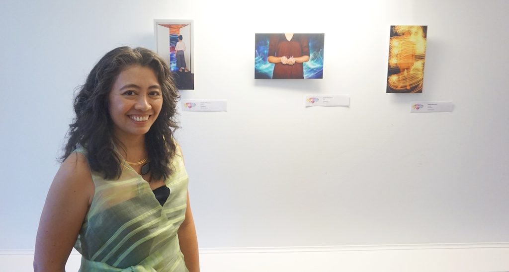 CITADEL CRUZ. The artists poses with her photographs on display at the embassy. Photo by Carol Ramoran