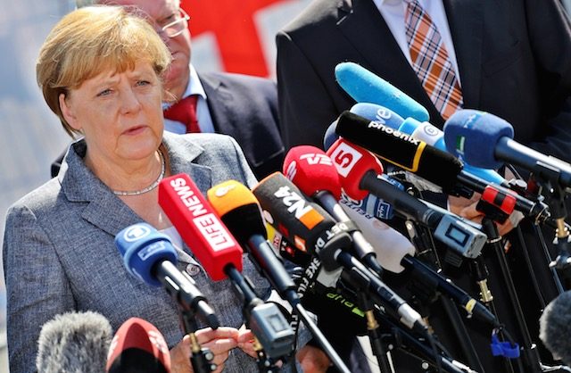 Merkel vows no tolerance for migrant hate as 55 die in Mediterranean