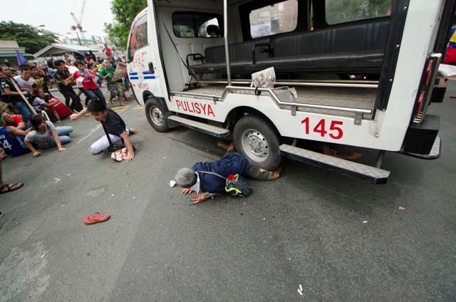 IN PHOTOS: Police van runs over protesters; PNP orders probe