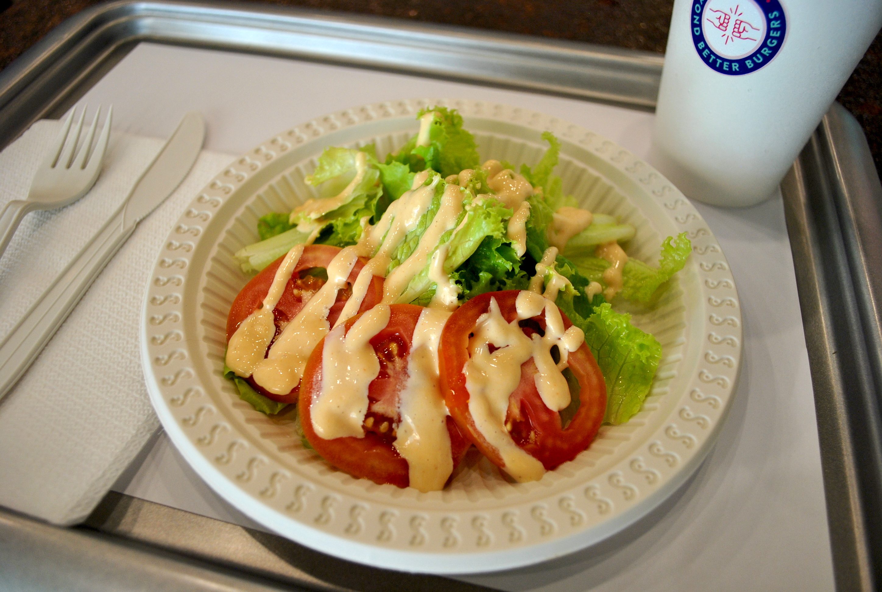 SIDE SALAD. Crisp greens and tomatoes are drizzled with a homemade caesar dressing. Photo by Steph Arnaldo/Rappler 