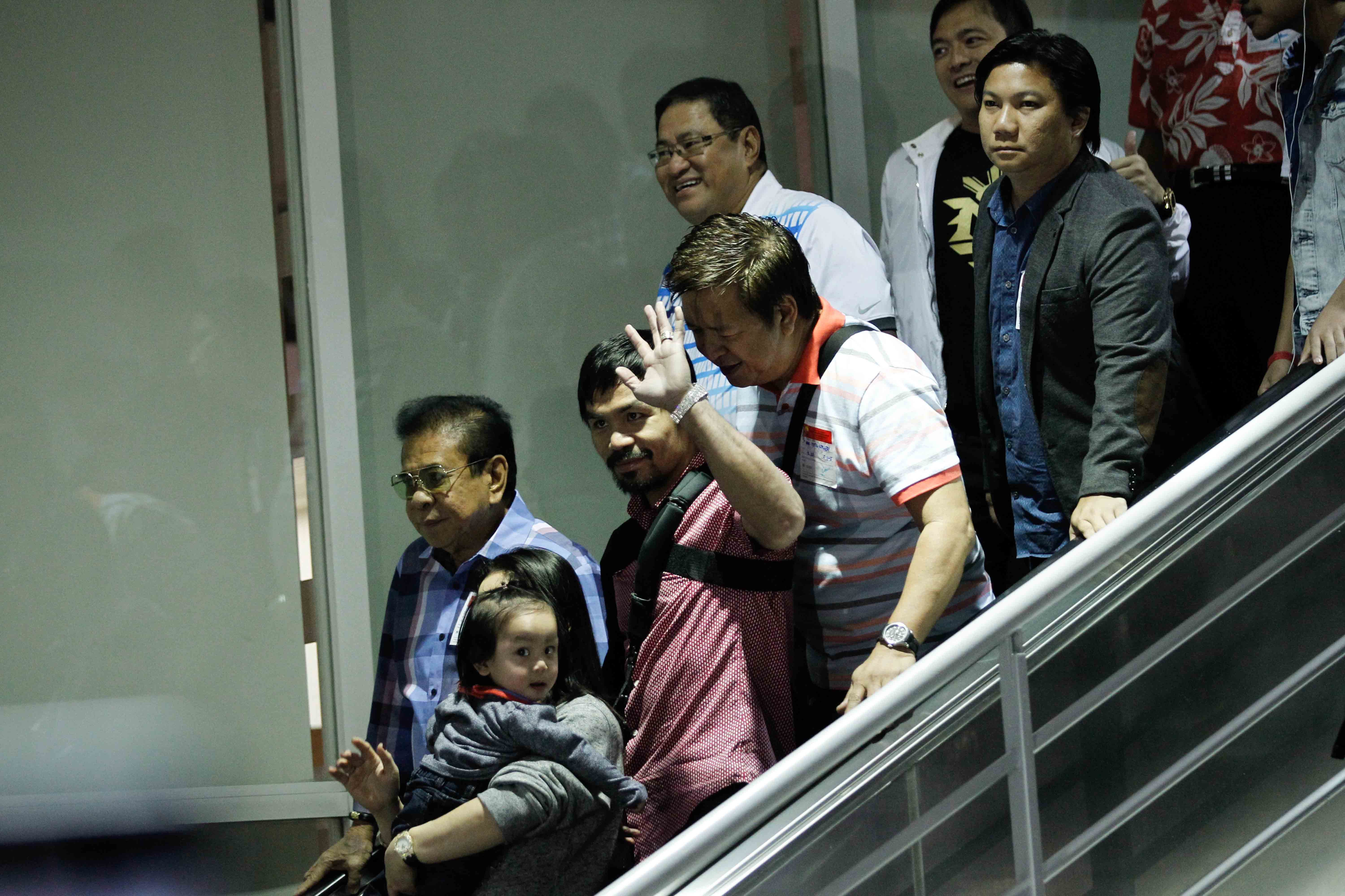 Filipino boxer Manny Pacquiao arrives in Manila, Philippines on May 13, 2015. Photo by Czeasar Dancel 