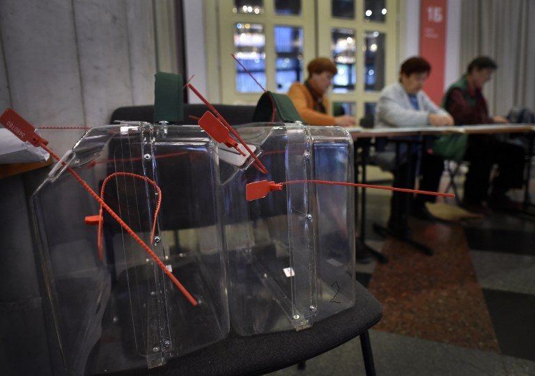 Russia votes for new parliament with Putin secure