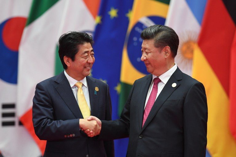China, Japan seek to improve ties as Xi, Abe meet