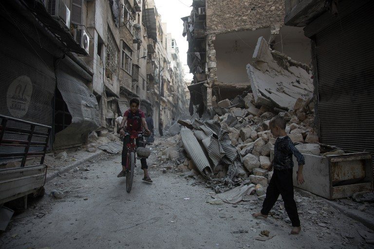 Syrian army retakes Aleppo district as bombs rain down