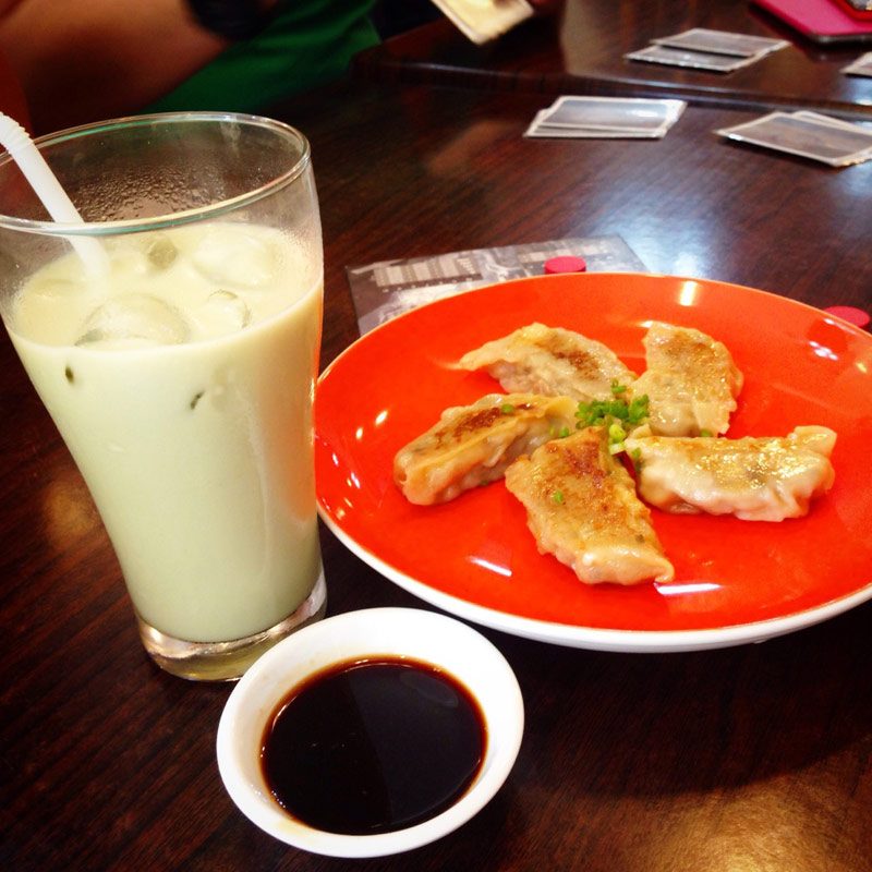LUDO BITES. Green tea latte and cheese gyoza. Menu items are your ticket to the games