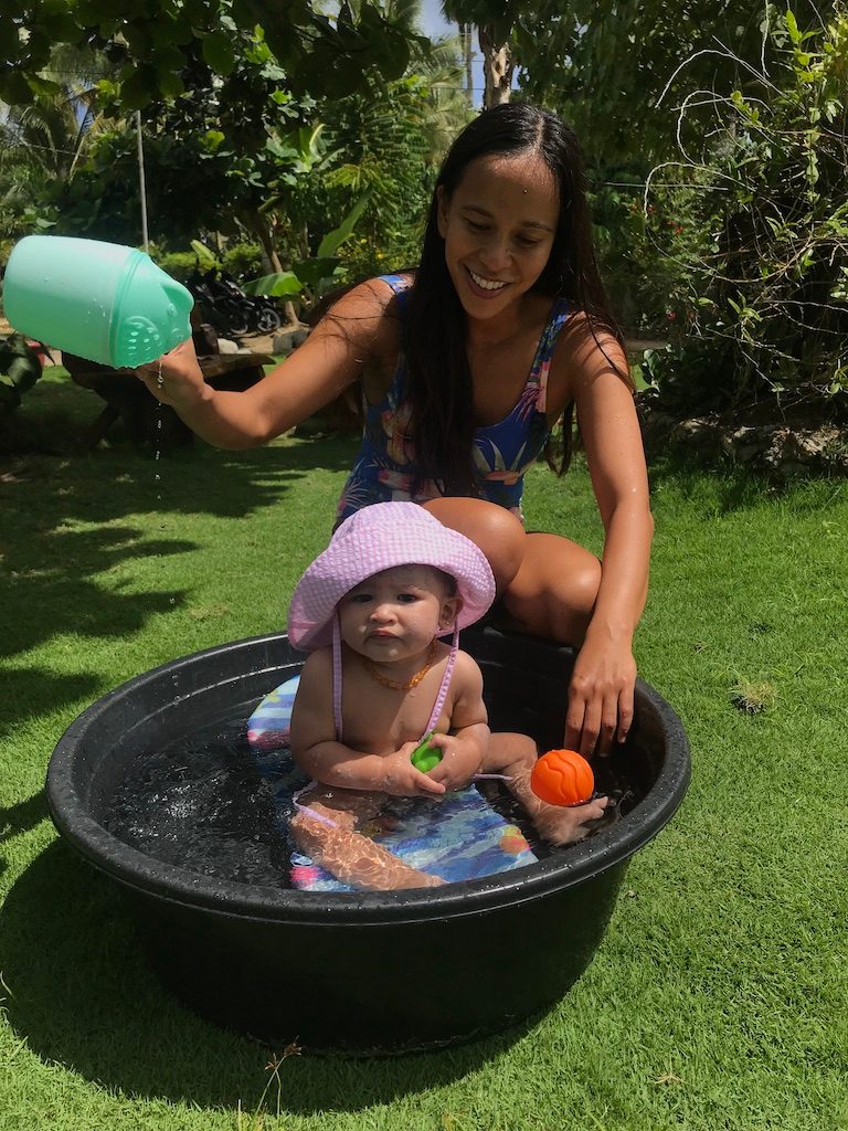 AFTERNOON DIP. They may not be allowed to swim in Siargao for now – but Elaine keeps Tala cool with their trusty palanggana. Photo courtesy of Elaine Abonal Bayer 