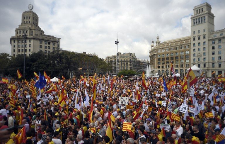 Spain marks national day with show of unity in Catalan crisis