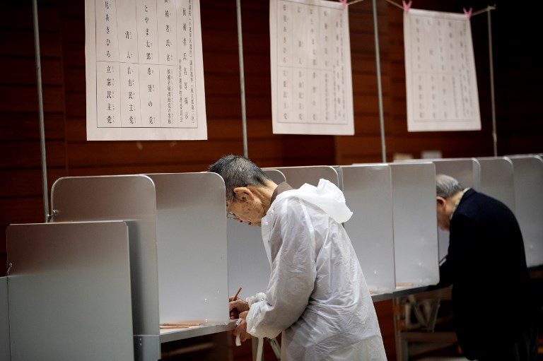 2 dead as typhoon brings heavy rain, wind to election-day Japan
