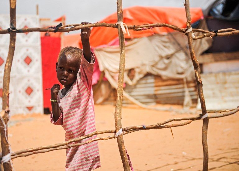 DISPLACED. A Somali boy stands next to a structure of a makeshift tent at Tawakal IDP camp in Mogadishu, Somalia, on June 19, 2018. Photo by Mohamed Abdiwahab/AFP   