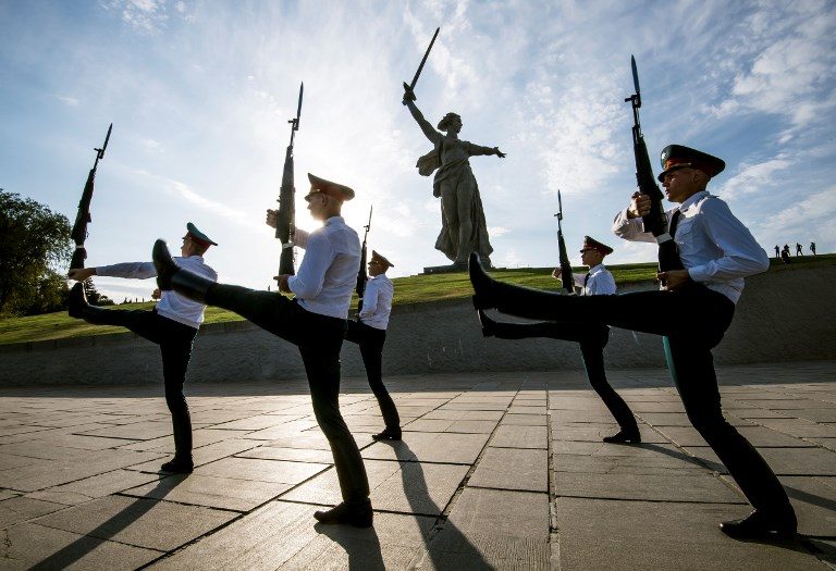 FIFA 2018 HOST. Soldiers march during the changing of the guard at the Mamayev Kurgan World War Two memorial complex and The Motherland Calls statue in Volgograd, Russia, on August 22, 2017. Photo by Miaden Antonov/AFP   