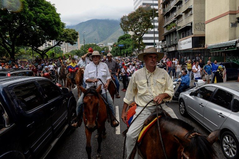 Venezuelans clog roads – even on horseback – in new anti-gov’t protest