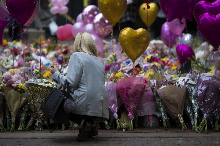 REMEMBRANCE. Balloons and flowers are laid as tribute to the victims of the May 22 terror attack at the Manchester Arena. Jon Super/AFP  