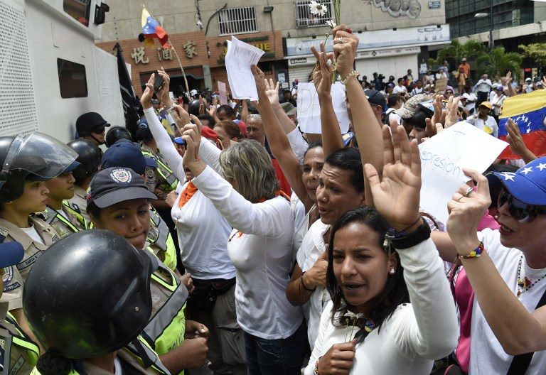 Women march to keep pressure on Venezuela’s Maduro