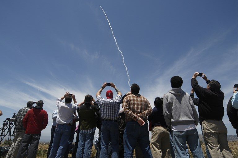 CAPTIVE AUDIENCE. People watch a ground-based interceptor missile take off at Vandenberg Air Force base, California on May 30, 2017. Photo by Gene Blevins/AFP   