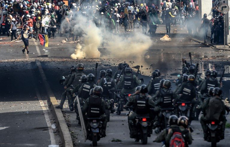 Clashes as Venezuela protesters target military base