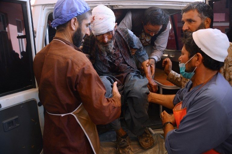 Roadside bomb hits Afghan bus, killing 11 and wounding 31