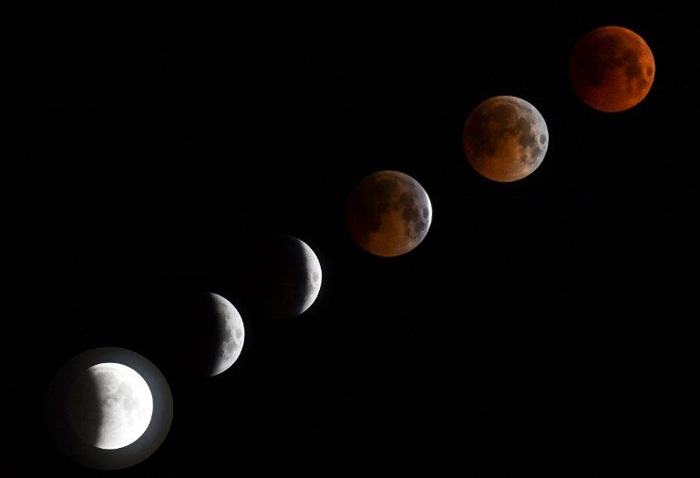 ECLIPSE. A combo of six pictures shows a 'blood moon' total lunar eclipse in Bishkek late on July 27, 2018. Photo by Vyacheslav Oseledko/AFP  