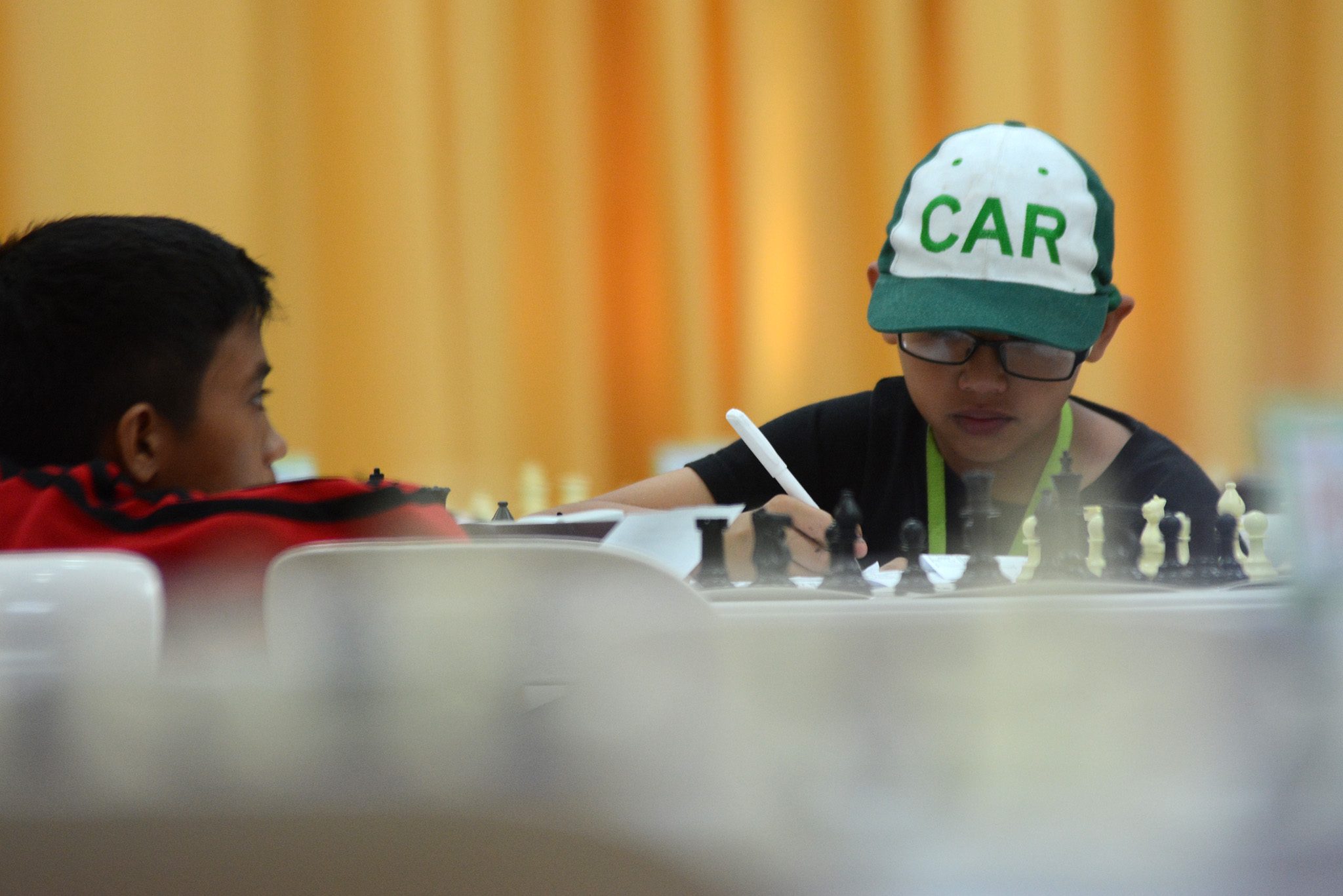 SERIOUS. A CAR athlete has his game face on during a chess match. Photo by Roy Secretario/Rappler  