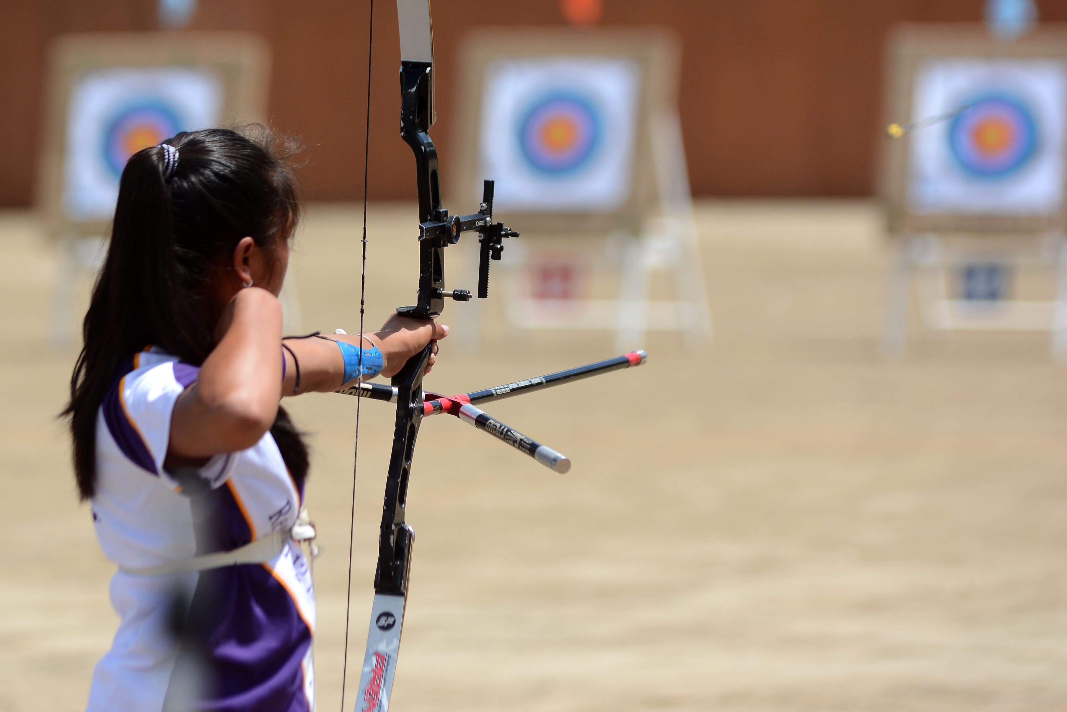 RELEASE. An archer releases her arrow in competition. Photo by Roy Secretario/ Rappler  