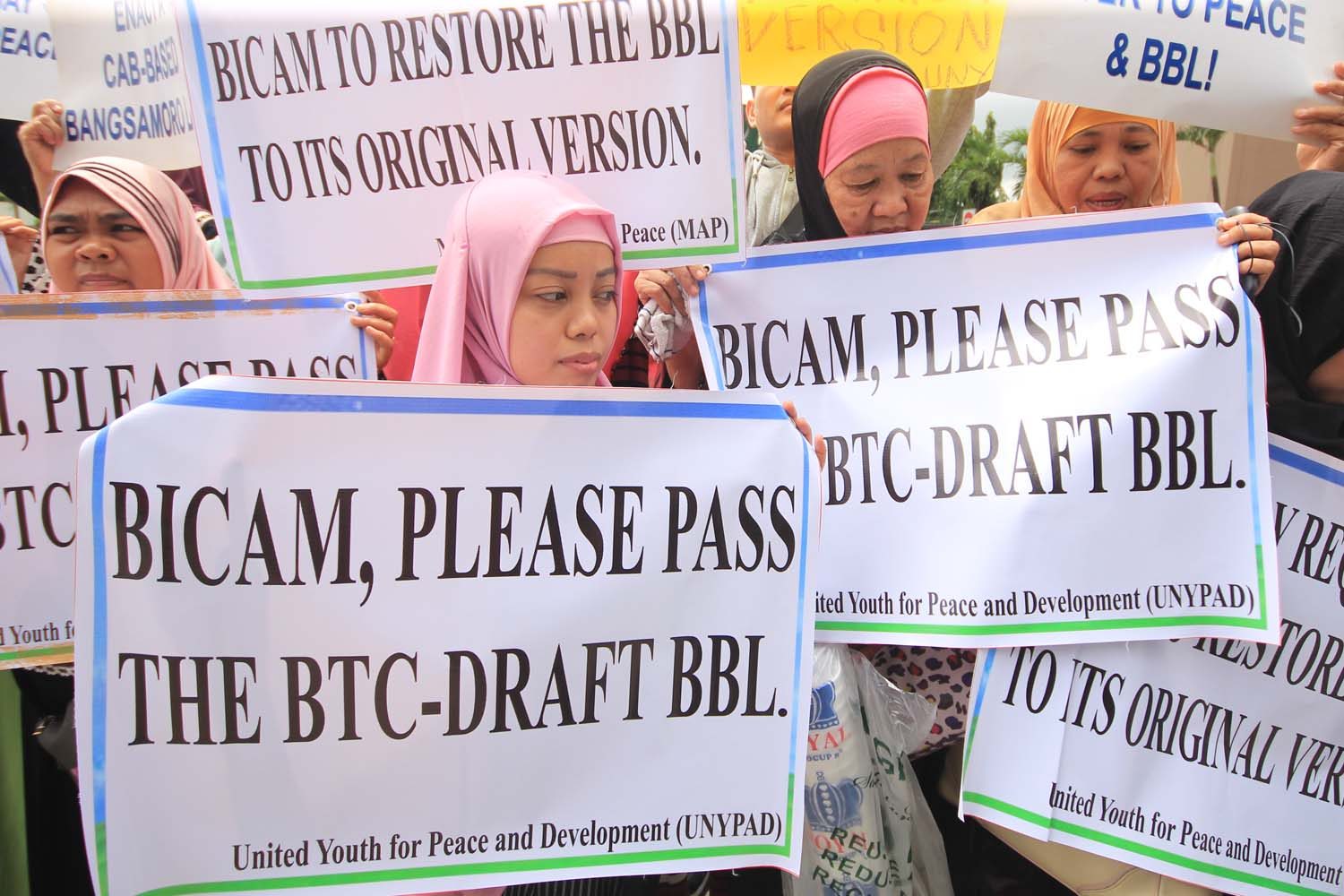 UNSATISFIED. Peace groups belonging to Bangsamoro communities hold a rally on July 10, 2018 outside the Crowne Plaza Manila Galleria, where the bicam met a few times to reconcile conflicting provisions of the bill. Photo by Darren Langit/Rappler   