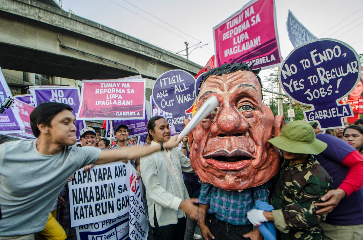 WITH MEN. After a program at the US Embassy, the group marched towards Malacanang with male activists joining them. 