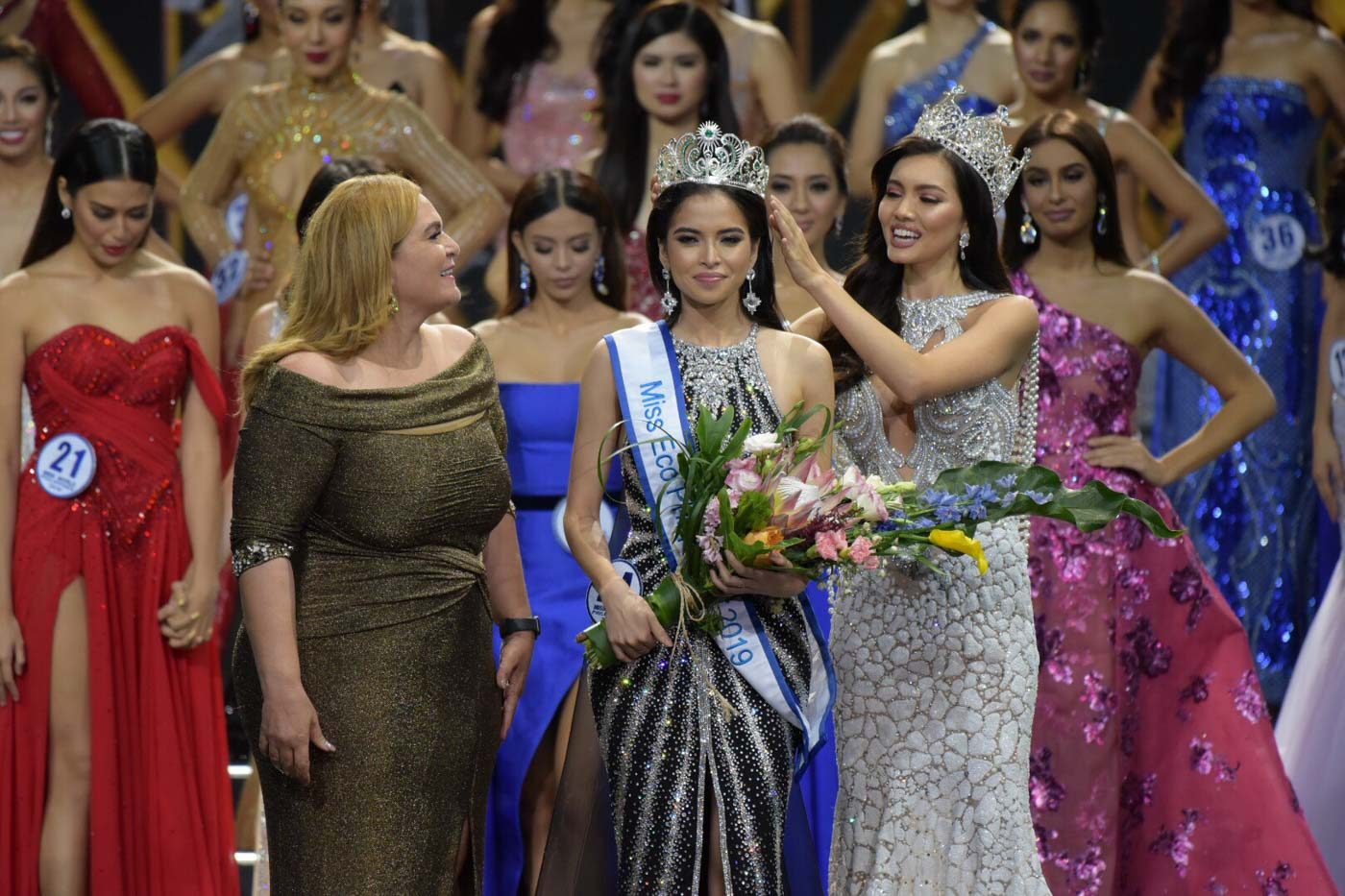 Kelley is crowned by Miss Eco Philippines 2018 Maureen Montagne and Miss Eco International CEO Dr. Amal Rezk. Photo by Alecs Ongcal/Rappler 